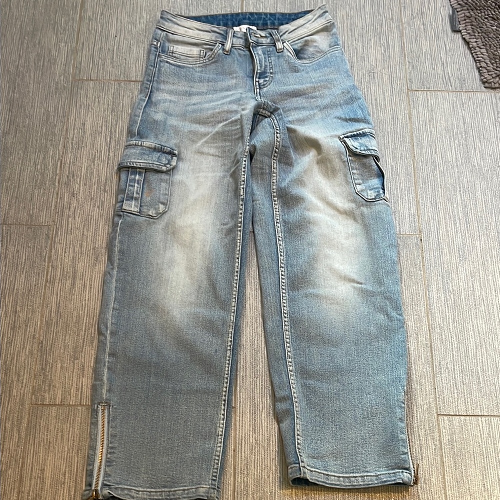 Venus brand new jeans with outer pockets and zippers on bottom size 2
